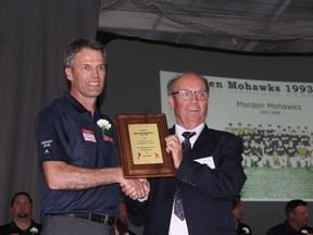 Kenton Hildebrand accepts recognition from Manitoba Baseball Hall of Fame and Museum Chair Morris Mott for the entrance of the 1993-2000 Morden Mohawks in the Major Team Category. (GREG VANDERMEULEN/Morden Times)