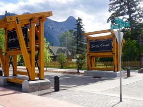 The Spring Creek Mountain Village signs stand at the corner of Main Street and Spring Creek Drive in Canmore, Alberta. Maureen McEwan/Crag & Canyon
