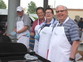 The council and town staff served up free hot dogs and burgers at the opening of Petrolia’s Farmers Market on May 26. From left, is Director of Cultural Services Richard Poore, CAO Rick Charlebois, Coun. Mary-Pat Gleeson and Mayor John McCharles.
John Phair/Special to Postmedia