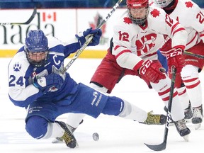 Mathieu Dokis-Dupuis, of the Sudbury Nickel Capital Wolves, gets tripped up by Cordel Larson of the Notre Dame Hounds during 2018 Telus Cup action in Sudbury in April.  Dokis-Dupuis, a draft pick of the OHL’s Niagara IceDogs has committed to playing for the NOJHL’s Rayside-Balfour Canadians in 2018-19. He is one of a number of players the Canadians have added following the start of the new Canadian Junior Hockey League year on June.  GINO DONATO/POSTMEDIA NETWORK