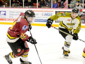 Timmins Rock forward Jordan Picard, shown here cutting to his right to avoid backchecking Powassan Voodoos forward Harrison Israels during Game 3 of the NOJHL East Division semifinal series at the McIntyre Arena on March 20, has committed to attend Portage College in Lac La Biche, Alta., and play for the Voyageurs in 2018-19. Picard wrapped up a three-year NOJHL career with the Rock last season.  THOMAS PERRY/THE DAILY PRESS