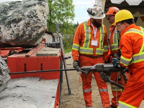 Cory Robin drills a boulder during the jackleg competition at the Canadian Mining Expo at the McIntyre Community Centre on Wednesday. He dug 32 inches.