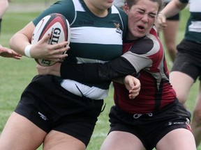 Northwestern's Claire Lavereau chases down a Courtice Secondary School player during the OFSAA 'A/AA' girls rugby championships Tuesday at SERC. Lavereau scored the Huskies' lone try in a 30-5 loss. Cory Smith/The Beacon Herald