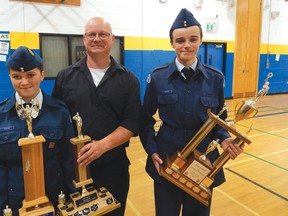 Photo by KELLY JAMES/FOR THE STANDARD
The Fortin family came away with top honours from the 59th Annual Inspection of the 696 Royal Canadian Air Cadet Squadron in Blind River last weekend. The brother and sister pair of LAC Trinity Fortin (who was named the squadron’s Outstanding Recruit) and Flt. Cpl. Kaidin Fortin (who was chosen as the squadron’s Top Cadet) surround their father, Cory Fortin, who serves as a civilian instructor for the squadron.