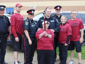 At the torch run were Keegan Wilcox, Acting Sergeant South Bruce OPP, Acting Sergeant  Kevin Martin-South Bruce OPP, Constable Adam Belanger- Bruce Peninsula OPP, Auxiliary Sergeant Kristina Parsons-West Grey Police, Constable  Ryan Cabral, Hanover Police, Special Olympics athlete-Helen Clancy, Sergeant Kevin Zettel-Saugeen Shores police, Inspector Dana Earley-South Bruce OPP and Constable Andrew Werlé- South Bruce OPP. (Don Crosby/Special to Postmedia)