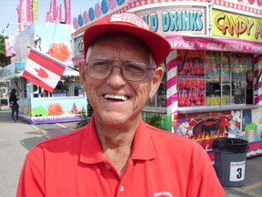 Len Parker is a co-chair of St. Anne's Festival, where he has volunteered for about 35 years. “I like just having fun - and seeing all the smiling faces,” he said on opening day Wednesday. The annual fair continues through Saturday. (Eric Bunnell/Times-Journal)