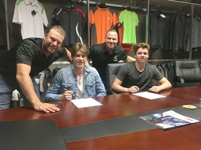The Sherwood Park Crusaders announced eight players have signed letters of intent for the upcoming season. Pictured are assistant coach Jeff Woywitka, Carter Savoie, head coach Adam Manah and Michael Benning. Photo Supplied