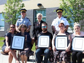 Alan Skoreyko, Colinne Stroud, Lisa Crawford and Families First Society received a framed certificate of appreciation from the RCMP on June 6 for their efforts in combating domestic violence.