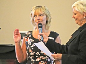 Incoming Fort Saskatchewan Chamber of Commerce president Lynn Wilkinson, left, is sworn in by Mayor Gale Katchur during the Chamber’s annual general meeting on June 6 at the Dow Centennial Centre.