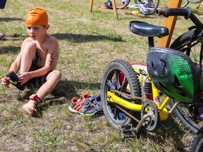 Millet’s Jackson Hofstra hurries to put on his socks as he transitions from the pool to the bike during the Wetaskiwin Triathlon, held in support of the Wetaskiwin Health Foundation. (Sarah O. Swenson/Wetaskiwin Times)