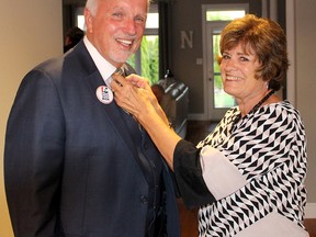 Progressive Conservative candidate Rick Nicholls gets his tie straightened by his wife Dianne, shortly before leaving to meet his supporters in Chatham, Ont. on election night,  Thursday June 7, 2018. (Ellwood Shreve/Chatham Daily News)