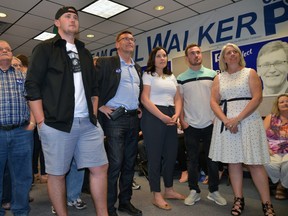 Bill Walker, second from left, watches results pour in along with his family at the Bruce-Grey-Owen Sound Progressive Conservative Party campaign headquarters on 9th Ave. E. on Thursday evening. Walker was re-elected for a third term as MPP of Bruce-Grey-Owen Sound. Pictured with Walker, are his wife Michaela, right, son Zach, second from right, Zach's girlfriend Conor Kelemen, third from right, and son Ben, at left. (Rob Gowan The Sun Times)