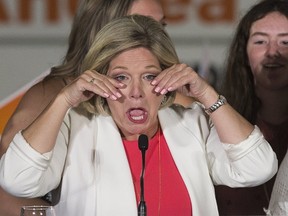 Ontario NDP Leader Andrea Horwath wipes tears from her eyes as she speaks to supporters,  after having conceded the Ontario election to PC leader Doug Ford in Hamilton, Ont., on Thursday, June 7, 2018. (Stan Behal/Postmedia Network)