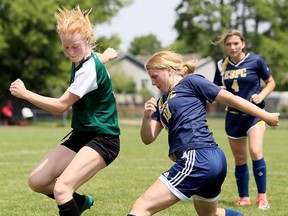 Pain Court Patriotes' Rachel Benn, right, battles Belleville Nicholson's Molly McKinney during a round-robin game in the OFSAA 'A' girls soccer championship at the Chatham-Kent Community Athletic Complex in Chatham, Ont., on Thursday, June 7, 2018. (MARK MALONE/Chatham Daily News/Postmedia Network)