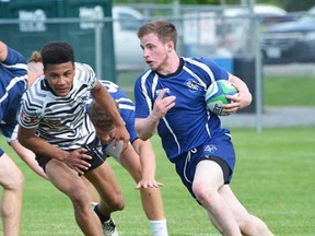 Quinte Saints ballcarrier Braden Tebworth on the burst during Day 1 action Thursday against Newmarket Denison at the OFSAA AA boys rugby championships on Field 3 at MAS Park. (Submitted photo)
