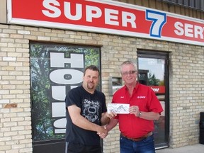 Dave Mosher from Super 7 Service hands David Leduchowski a check for $500.00 towards the Teulon Ride In Rally for Project New Hope Canada. (Kelsey Schaefer/Interlake Publishing/Postmedia Network)