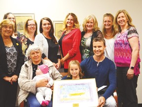 Kindergarten student Amalia joined the board at their May 30 meeting. She was recognized by the Alberta Transportation Advisory Council for her drawing of safe school busing.  (Lisa Berg/Rep staff)