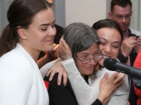 Sophie Kiwala is hugged by her daughters Helene, left, and Linnaea after speaking to supporters at the Holiday Inn in Kingston on election night on  Thursday June, 7 2018 after losing her Kingston and the Islands provincial Liberal seat to Ian Arthur of the NDP.  Ian MacAlpine/The Whig-Standard/Postmedia Network