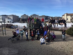 Grade 6 students from C.W. Perry pose together on a community walk in Sagewood.