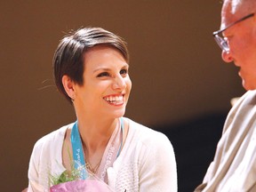 Meagan Duhamel, two-time world pairs figure skating champion and three-time Olympic medallist, shares a laugh with Greater Sudbury Mayor Brian Bigger during a celebration honouring Duhamel at Lively District Secondary School in Lively, Ont. on Friday June 8, 2018. John Lappa/Sudbury Star/Postmedia Network