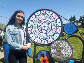 Keith Dempsey/For The Sudbury Star Kallista Jeffery of St. Albert’s shows off her art creation, which will be on display at the green stairs at Ste. Anne’s Road.