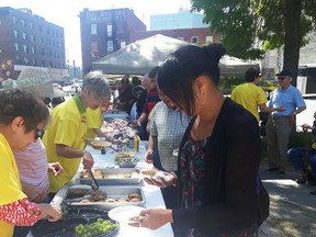 Keith Dempsey/For The Sudbury Star
People grab food and drinks at a free barbecue put on by six downtown churches on Friday afternoon.