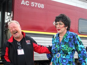 Ian McMillan, executive director of Tourism Sault Ste. Marie, cracks up at Timothy Murphy, as Gina Lola-International-Bridgida before the start of Way Too Funny Festival's Murder on the Agawa Express on Saturday.