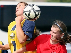 Pain Court Patriotes' Raine Avey heads the ball away from Burlington Pearson's Hailey Maltman during a round-robin game in the OFSAA 'A' girls soccer championship at the Keil Drive soccer complex in Chatham, Ont., on Friday, June 8, 2018. (MARK MALONE/Chatham Daily News/Postmedia Network)