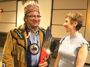 Batchewana First Nation Chief Dean Sayers and Asima Vezina, president of Algoma University, speak following her installation speech at Marconi Hall on Friday.,