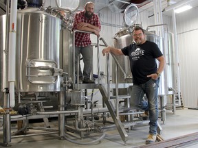 Partners Phil Buhler, left, and Dave Oldenburger seen at their brewery, Jobsite Brewing Co., on Cambria Street. Their goal is to open their business within the next month and launch with four variety of craft beers. JONATHAN JUHA/THE BEACON HERALD/POSTMEDIA NETWORK