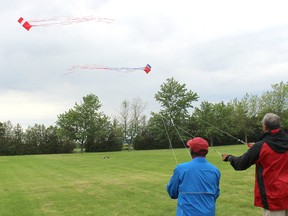 Windjammers International Kite Performance Team founding members Nate Williams, left, and Gary Maynard each fly a multi-sail kite during the Wheatley WindFest event in Wheatley, Ont. on Saturday June 9, 2018. Ellwood Shreve/Chatham Daily News/Postmedia Network