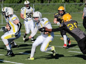 Soo Steelers Andrew Jones carries the ball with support from Justin Dubreuil and Dalton Povey during Northern Football Conference action against North Bay Bulldogs on Saturday in the Gateway City. (DAVE DALE/Postmedia Network)