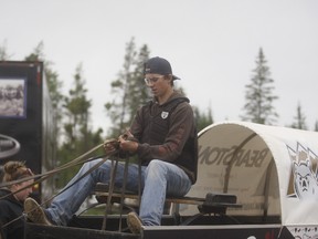 Tuff Dreger (shown here) fixes the lines on his chuckwagon at Evergreen Park on Saturday afternoon. The 15-year-old is making his racing debut this weekend at the Boots & Moccasins chuckwagon event this coming weekend.
