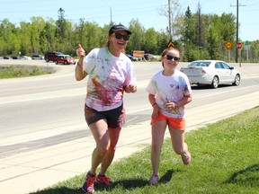 Sue Gadoury, left and Avery Deforge, 10, were covered in powder during the fifth annual Colour it Up! fundraiser held by the Seizure and Brain Injury Centre at the Children’s Treatment Centre’s Kinross Place on Saturday, June 16. Proceeds from the run will go to help fund programs and services the Seizure and Brain Injury Centre offers such as New Beginnings.