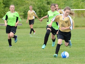 Katana Rovers, right of the Chatsworth Honey squad is chased by Maya Beirnes and Lilly Green, left, of the Owen Sound Physio Clinic team during an under-12 girls game that was part of the Owen Sound Minor Soccer Association's Soccer Day at the Kiwanis Soccer Complex on Saturday, June 9, 2018 in Owen Sound, Ont. The day featured a number of games as well as fun events, prize draws and a barbecue. Rob Gowan/The Owen Sound Sun Times/Postmedia Network