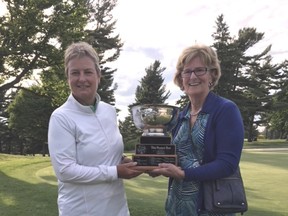 Gail Pimm, left, is presented the Whig-Standard Rose Bowl by Wendy Shelley for having the low score in the Cataraqui Women's Field Day on Saturday. (Supplied Photo)