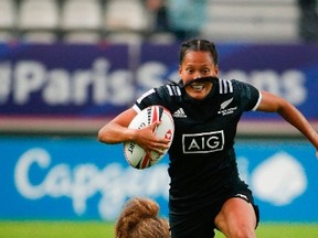 New Zealand's Tyla Nathan-Wong, right, runs away from Canada's Breanne Nicholas of Blenheim, Ont., during a women's semifinal in the HSBC World Rugby Sevens Series at Jean Bouin Stadium in Paris on June 9, 2018. (GEOFFROY VAN DER HASSELT/AFP/Getty Images)