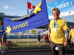 Community champion Brian Donlevy leads the way along with Woodstock Mayor Trevor Birtch during the survivor's lap. (Chris Funston/Sentinel-Review)