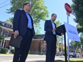 Queen's University Principal Daniel Woolf, left, and Kingston Mayor Bryan Paterson announce a pilot project meant to curb uncontrolled student partying in Kingston, Ont. on Monday, June 11, 2018. 
Elliot Ferguson/The Whig-Standard/Postmedia Network