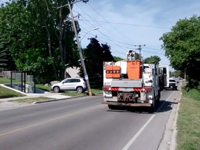 Power was out for nearly eight hours Sunday to a number of Hydro One customers after a car rolled back into a hydro pole in the 1100-block of 10th Street East in Owen Sound. Firefighters suspect the outage may have led to a house fire once power was restored at a nerby semi-detached home. (Laurie Symon photo)