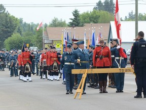 The "Freedom of the City" parade stops before the Town Office on June 9 (Peter Shokeir | Whitecourt Star).