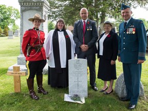 RCMP Const. April Delorme, Rev. Veronica Wilson, Rector of Snettisham, Stuart Dark, Snettisham Councillor, Rose Pugh, Chair of the Snettisham Parish Council and Col. Mark Goulden, 8 Wing Trenton Commander gather at the grave of Lt. Colin Coleridge in the Deseronto Cemetery, following a special commemorative ceremony on June 9, 2018.  Leaving his family in Snettisham, England in 1911, Lt. Coleridge moved to Canada to serve as a Northwest Mounted Police officer in Saskatchewan and Manitoba, before enlisting in the Royal Flying Corps (later renamed the Royal Air Force) in 1917. Lt. Coleridge was killed in a plane crash in July 1918 at Camp Mohawk, near Deseronto.