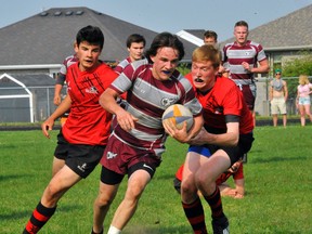 Holy Trinity's Jason Jones competes in the NSSAA boys rugby championship last month. Jones and the Titans made it to the consolation final of the OFSAA A/AA Rugby Championships in Belleville late last week.
JACOB ROBINSON/Simcoe Reformer