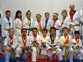 Competitors from the Sarnia Olympic Taekwondo Academy show off their medals following two recent tournaments in Toronto and Michigan. Front row: Gage Galvanek (left), Josiah Knight-Laurie, Chris Trandafir, Sage Underhill-Caron, Joey Pimentel, George Bailey, and Elyjah Field. Back row: Master Mark Warburton (coach), Brandon Tang, Charsey Desaulnier, Taylor Salminen, Emma Lebelle, Greg Galvanek, Milo Martin, Carson Baker,Daniel Bailey and Master Jason McIntyre (coach). Absent from the photo are Nathan Lapier, Evan Kim and Shaydon Evans.
Handout/Sarnia This Week