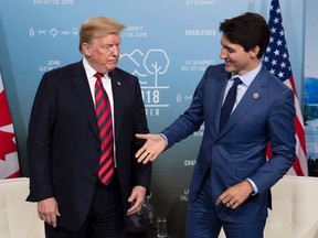 Canada's Prime Minister Justin Trudeau shakes hands with U.S. President Donald Trump during a meeting at the G7 leaders summit in La Malbaie, Que., on Friday, June 8, 2018. THE CANADIAN PRESS/Justin Tang