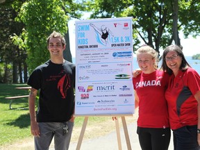 Iain Sherriff-Scott/For The Whig Standard
Y Penguins athletes Nick Tolygesi and Abi Tripp stand with their coach, Vicki Keith, at the launch event for the second annual Kingston Swim for Kids. The event is set to take place on Aug. 11