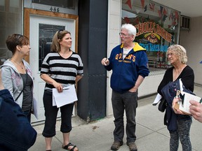 Norfolk County Councillor Peter Black (centre) talks with people participating in an Imagination Walk on Saturday as the county sought ideas from citizens on how to improve Simcoe's downtown. Brian Thompson/Brantford Expositor/Postmedia Network