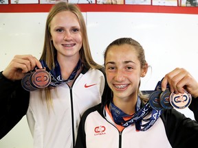 CKSS Golden Hawks teammates Camille Blain, left, and Emma Pegg each won three medals, including one gold apiece, at the 2018 OFSAA track and field championships in Toronto. They're pictured at Athletes' Fuel Strength & Conditioning in Chatham, Ont., on Monday, June 11, 2018. (MARK MALONE/Chatham Daily News/Postmedia Network)