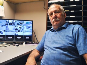 Doug Bruynsma, chair of the Chatham Bible for Missions, is shown next to live security footage at its Thrift Store on Wellington Street. The store recently had about $2,000 in jewelry taken in an alleged break-in, which was another in a series of incidents over the last year. Tom Morrison/Chatham This Week