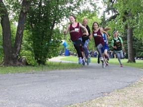Runners round the corner exiting Spruce Haven Park during the annual Melfort Elementary School Cross Country Run on Monday, June 4.